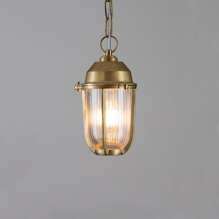 This Old School Electric Boatyard Pendant Light exudes maritime charm with its nautical inspiration and features a clear glass shade.