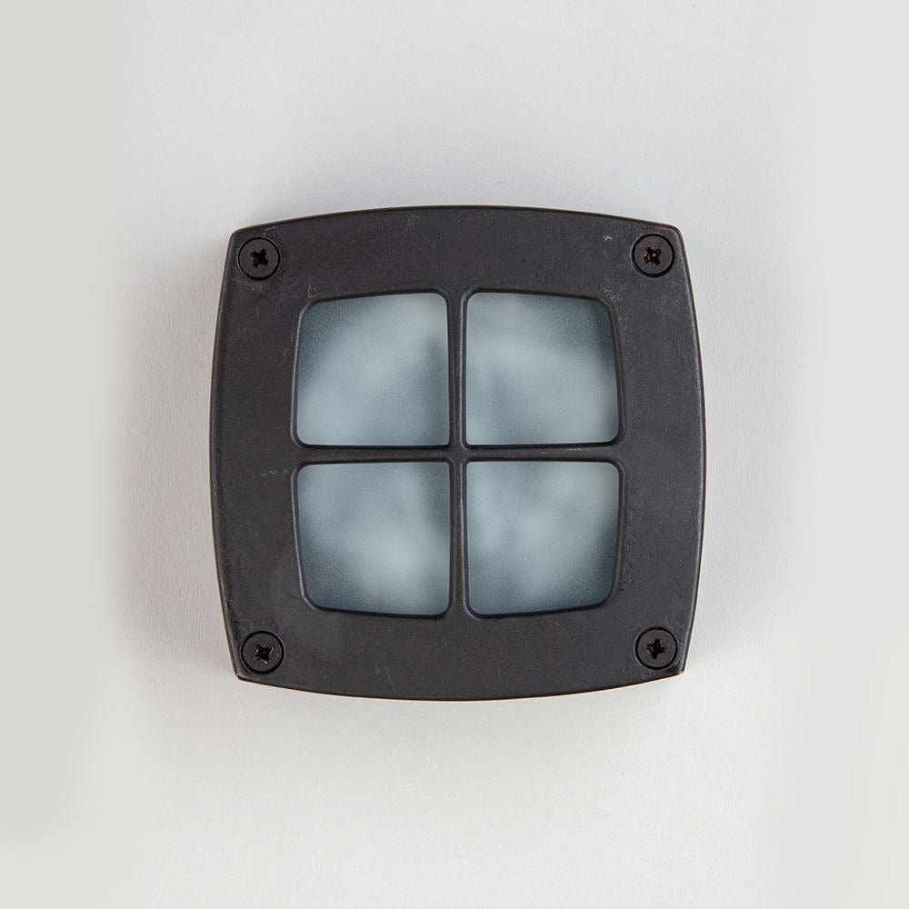 An Old School Electric Square Outdoor Path Light on a white surface.