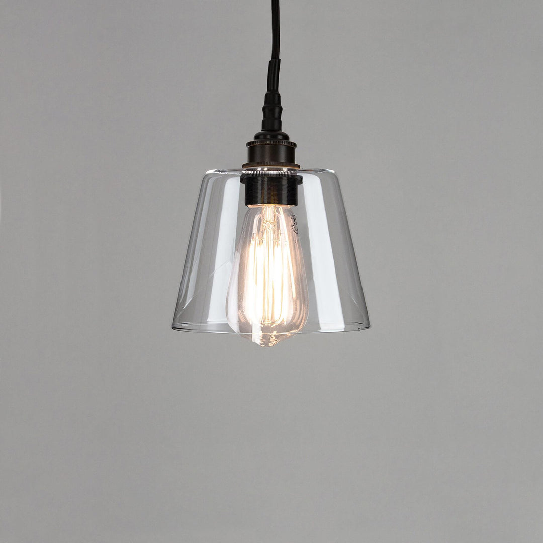 An Old School Electric Tapered Blown Glass Bathroom Pendant Light with a metal frame. Suitable for electric lights and lighting fixtures.