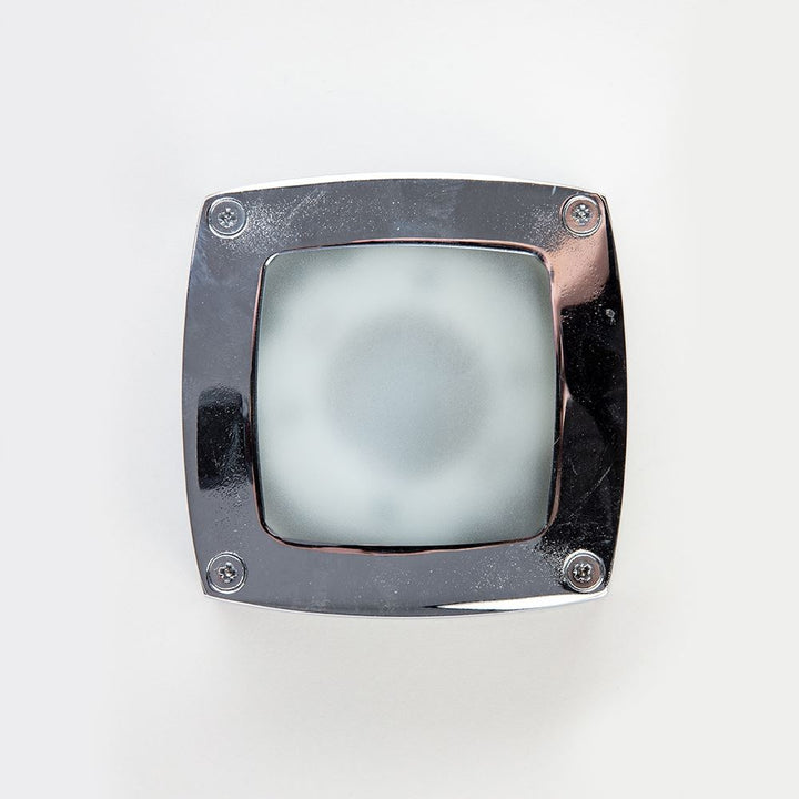 An Old School Electric Square Outdoor Path Light on a white surface.