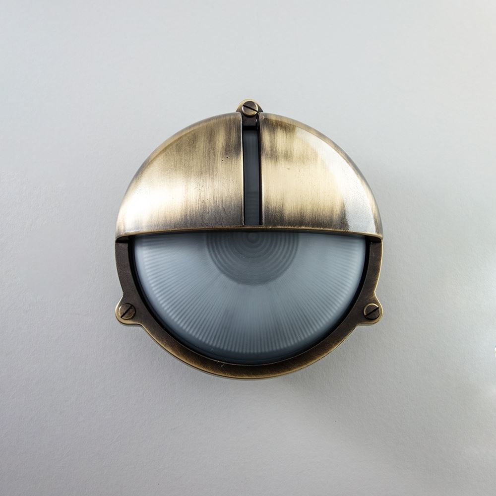 An Old School Electric Round Bulkhead With Eyelid Wall Light.
