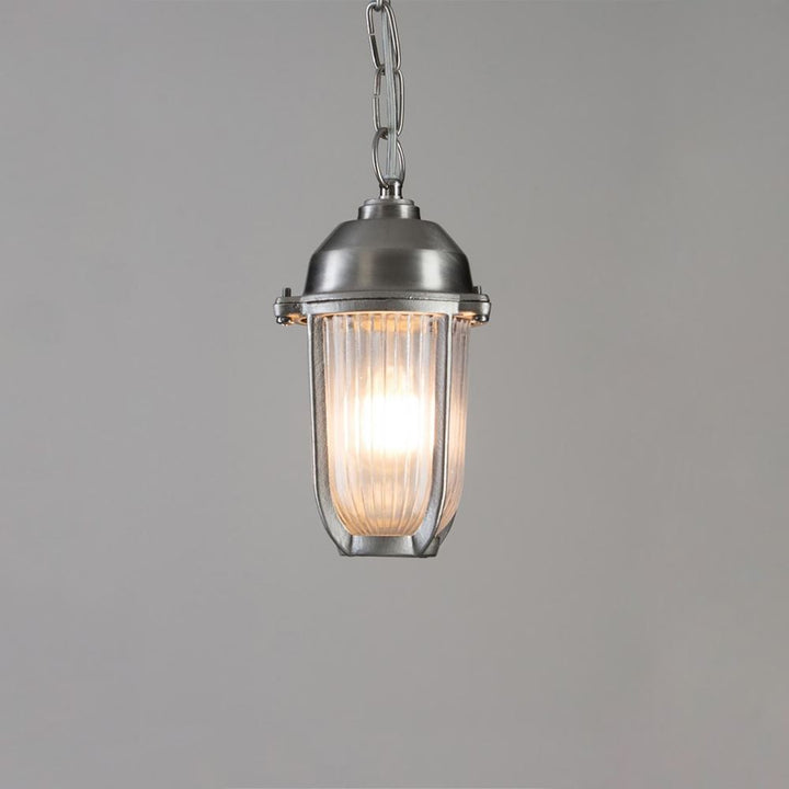 Bring maritime charm to your outdoor space with the Old School Electric Boatyard Pendant Light. This nautical-inspired fixture features a clear glass shade, illuminating your surroundings with style and elegance.