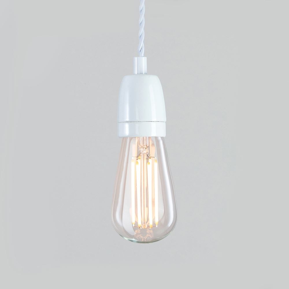 An Old School Electric Ceramic Cable Set light fitting hanging from a cord.