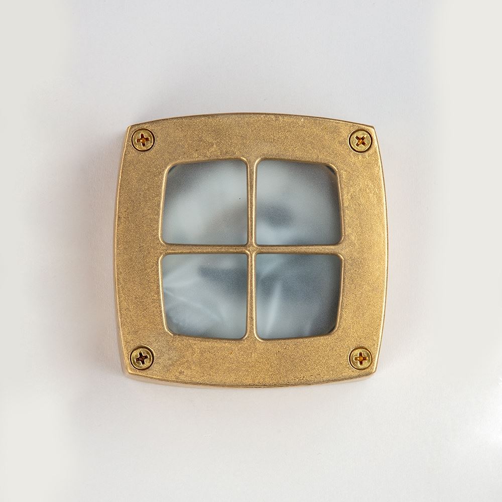 An Old School Electric Square Outdoor Path Light on a white surface featuring a designer light fixture.