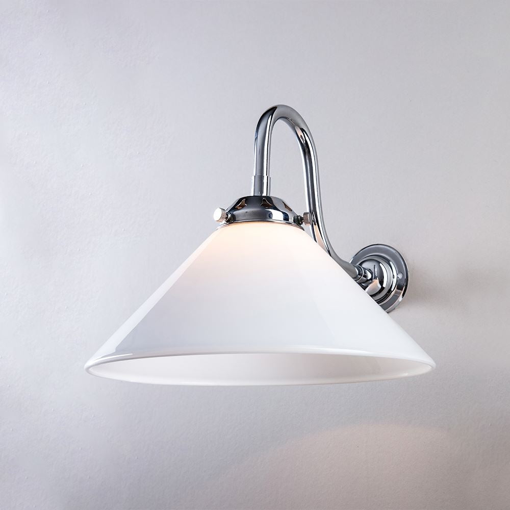 An Old School Electric Conical Glass Bathroom Wall Light (B22) with a white shade on a white wall.